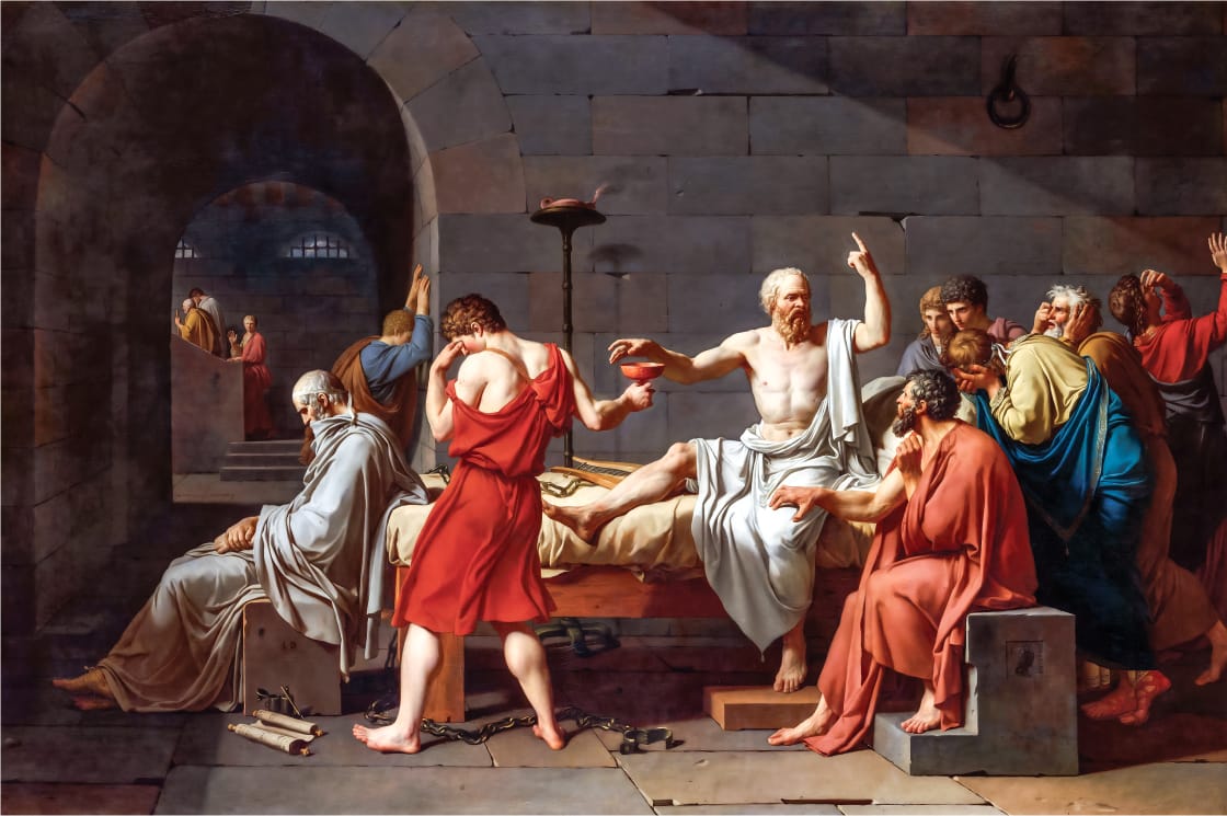 A group of men in ancient Greek attire surround a bed where an elderly man, raising one hand, receives a cup from another man. The scene is intense and emotional, set in a stone room with arched openings.
