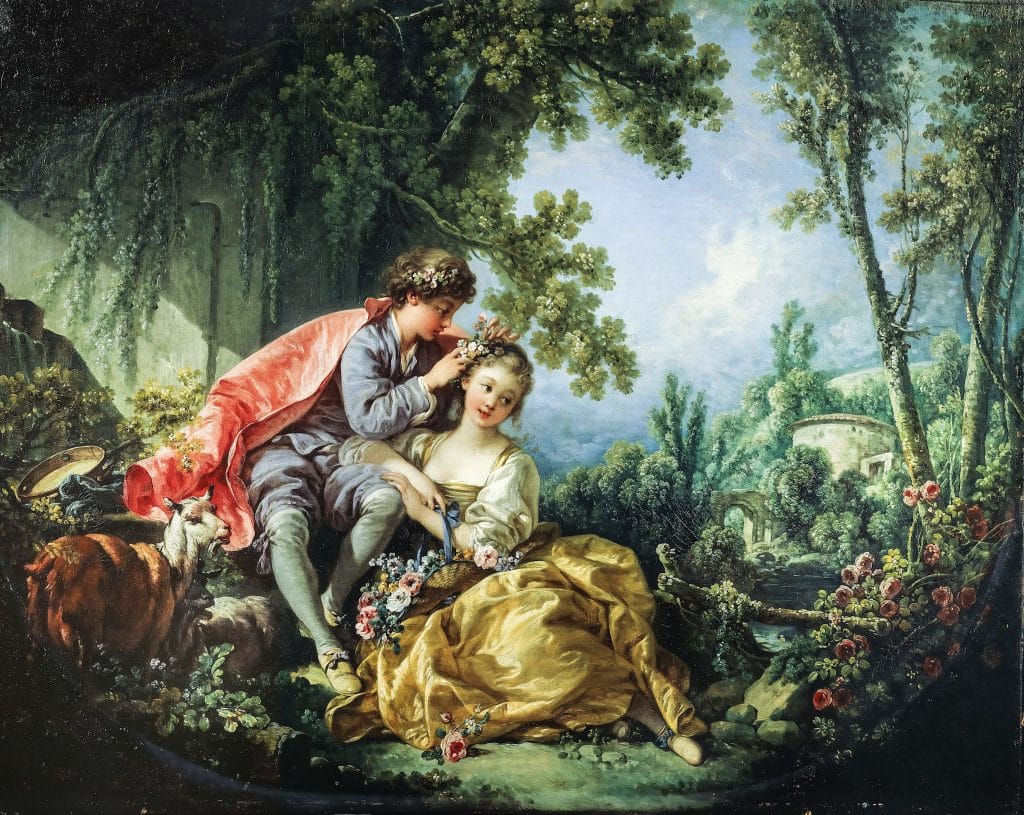 A young couple sits under the trees in a blooming landscape. The man crowns the smiling woman with a flower garland while goats and sheep rest nearby in a richly wooded glade.