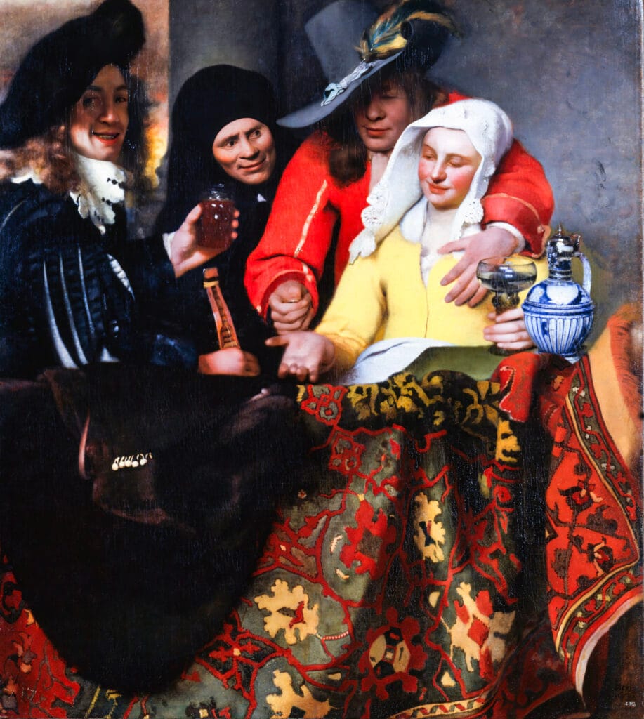 A lively group of three men and a woman sit around a table covered with a colorful, intricately patterned cloth. The woman, dressed in yellow, appears engaged, holding a glass jug. One man in a red jacket affectionately leans towards her, while another in a black hat grins, holding a glass of wine. The atmosphere is convivial and festive.