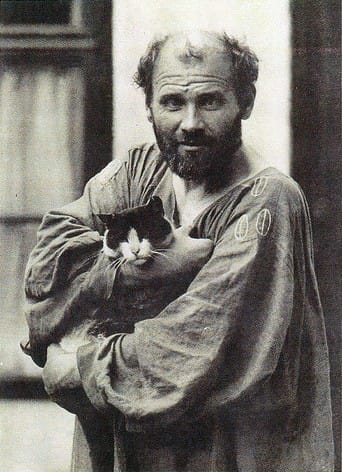 Gustav Klimt. A bearded man in a loose shirt holds a calm black-and-white cat. The image conveys a serene, tender moment, evoking warmth and companionship.