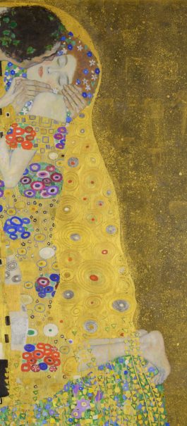 A man and woman embrace, wrapped in intricate golden patterns. The woman closes her eyes, conveying tenderness. A field of flowers lies beneath them.